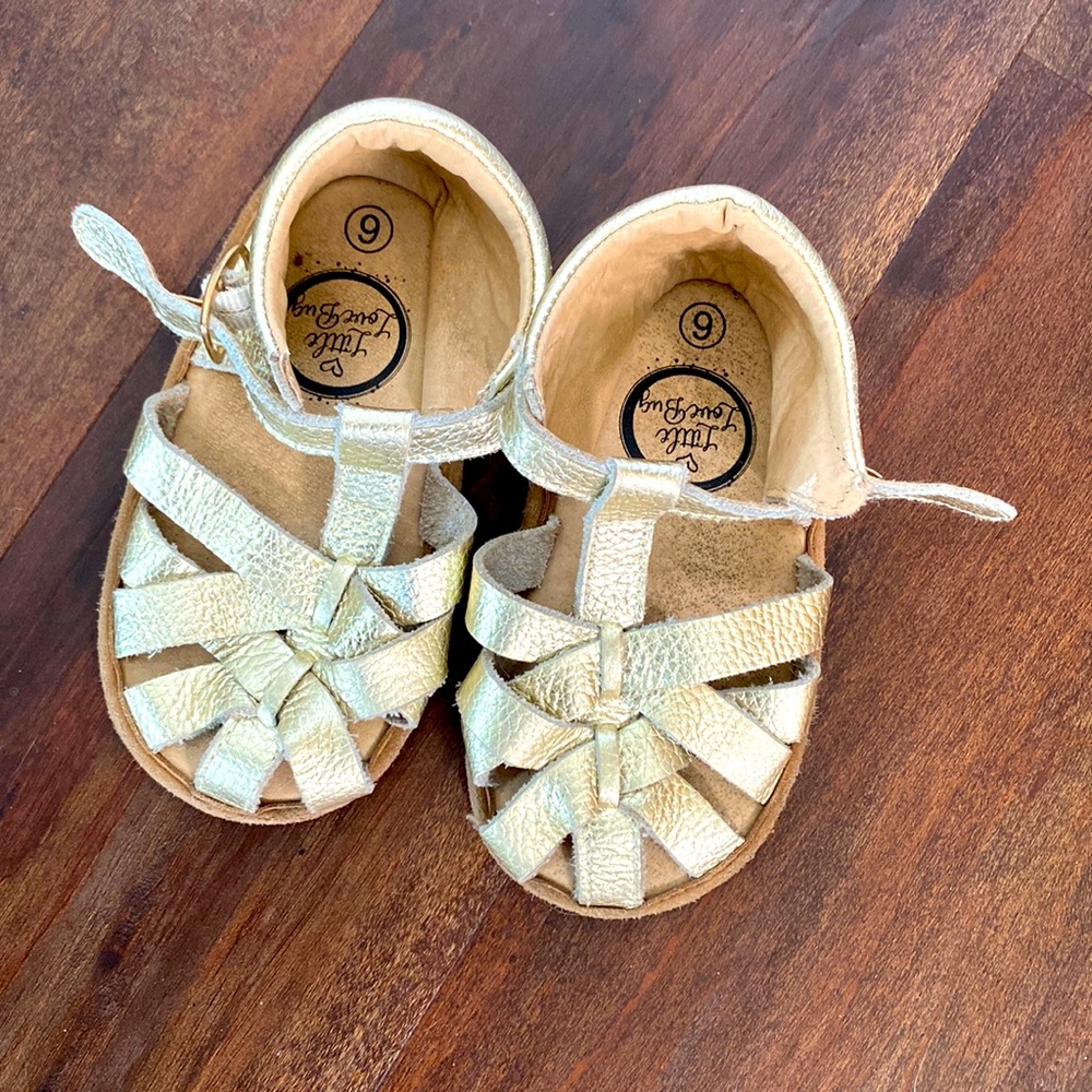 Gold buckled sandals with minimalist sole